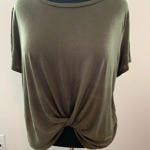 Super cute olive green shirt with a knot in front.